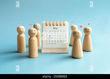 International Family Day concept. Circle mark on date May 15, 2023, on May  month page desk calendar near happy smiling wooden figures, people with lov  Stock Photo - Alamy