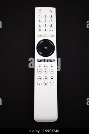 White remote control for TV on black background Stock Photo