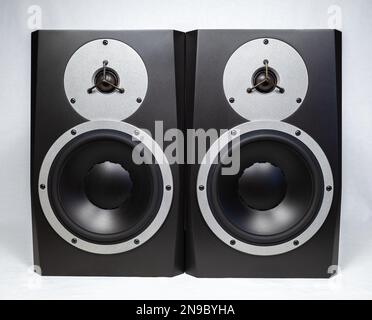 Two black audio speakers isolated on white background, musical equipment Stock Photo