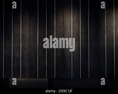 Black wood texture background, vertical style. Dark wooden plank wall striped pattern decoration in dark room with the lighting from spotlight. Stock Photo