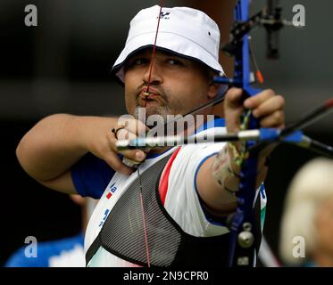 Italy s Michele Frangilli shoots during the elimination stage at