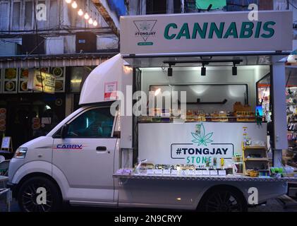 A mobile truck at Patpong street market, Silom district, Thailand, Bangkok, Asia, advertises cannabis for sale. In 2022 Thailand delisted cannabis as a narcotic; many shops have sprung up to sell it. Stock Photo