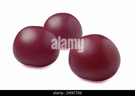 Three purple tomatoes isolated on white background Stock Photo