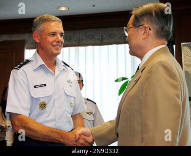 New U.S. Forces Japan Commander Lt. Gen. Salvatore A. Angelella, left, is welcomed by Japanese Defense Minister Satoshi Morimoto before a meeting at Defense Ministry in Tokyo Friday, July 27, 2012. (AP Photo/Koji Sasahara)