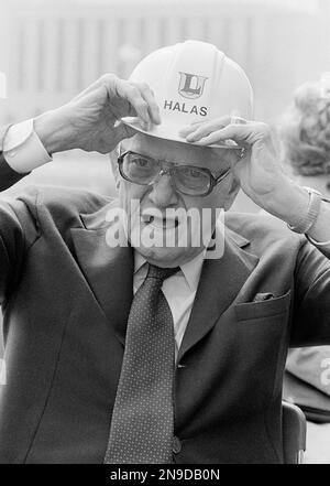 George Halas, owner-president of the Chicago Bears, seems to have some  interested listeners in Jack Jennings, center, of the Chicago Cardinals,  and Chuck Bednarik, right, of the Philadelphia Eagles, as they wait