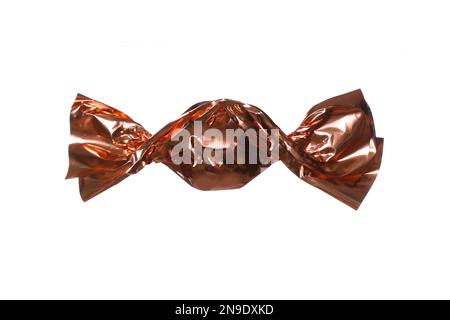 candy in a golden wrapper isolated on white background Stock Photo