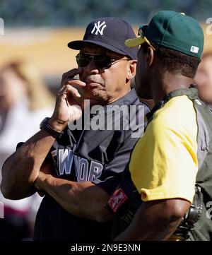 New York Yankees Rickey Henderson, left, greets Yankees relief pitcher  Mariano Rivera before the Old Timers Day baseball game Sunday, June 23,  2013, in New York. (AP Photo/Kathy Willens) ORG XMIT: NYY101