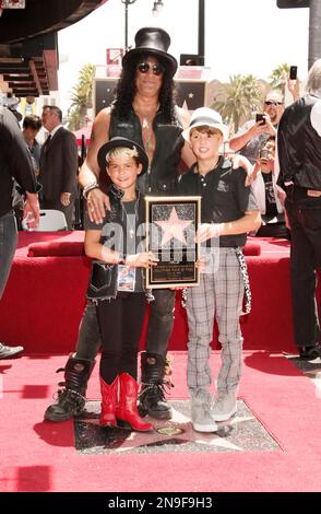 Musician Slash, sons Cash Hudson and London Hudson attending a ceremony