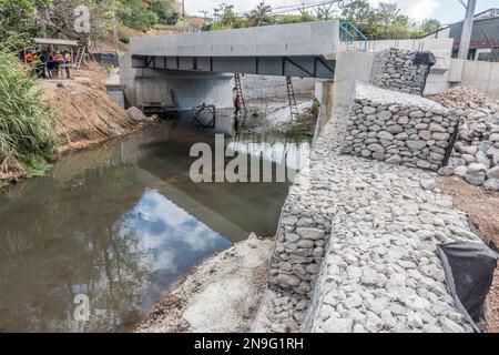 Construction of a small bridge over a little river in San José, Costa Rica. Stock Photo