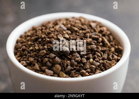 Vegan organic plant based garden NPK fertilizer in a small bowl. Stock Photo