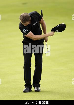 Jamie Donaldson from Wales reacts on the 18th green after winning the Irish Open Golf Championship at Royal Portrush Golf Club, Portrush, Northern Ireland, Sunday, July 1, 2012. (AP Photo/Peter Morrison)