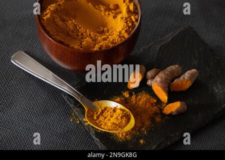 turmeric roots and powder. healthy spice concept Stock Photo