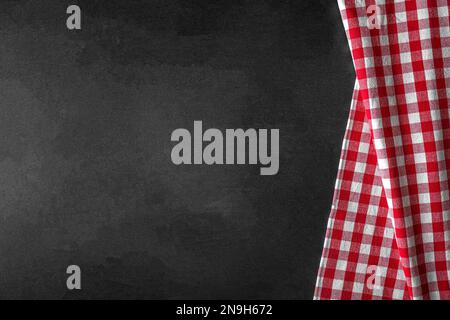 Checkered tablecloth on a black background. Stock Photo