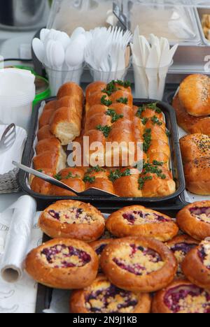 Stand with fresh sweet and savoury pastries on display at the Náplavka Farmers' Market in winter at the beginning of the new season. Stock Photo