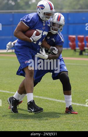 FILE ** Denver Broncos running back Tatum Bell carries the ball against the  Buffalo Bills in this Dec. 17, 2005 photo, in Orchard Park, N.Y. The game  means next to nothing