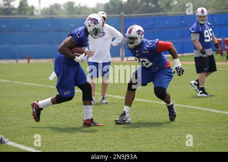 FILE ** Denver Broncos running back Tatum Bell carries the ball against the  Buffalo Bills in this Dec. 17, 2005 photo, in Orchard Park, N.Y. The game  means next to nothing