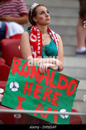 A Portugal fan waits for the start of the Euro 2012 soccer championship quarterfinal match between Czech Republic and Portugal in Warsaw, Poland, Thursday, June 21, 2012. (AP Photo/Armando Franca)