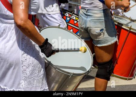 Drums and drummers playing samba during carnival celebrations in the streets of Brazil Stock Photo