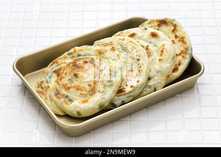 Homemade Chinese green onion pancakes. The inside is layered. Stock Photo