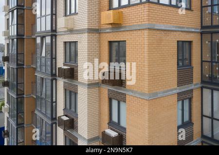 Building exterior with decorative air conditioner covers Stock Photo