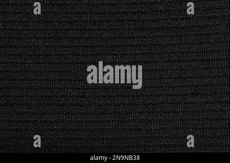 Black fiber canvas texture macro close up view. Mesh cloth material Stock Photo