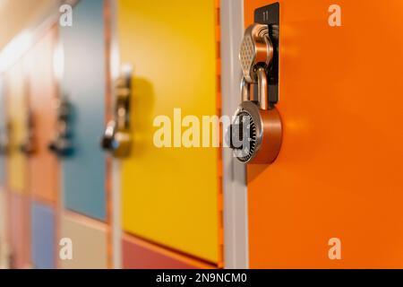 Combination locks on colorful school lockers Stock Photo