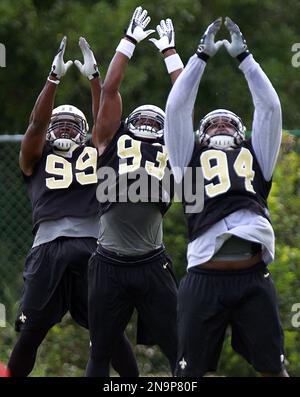 New Orleans, USA. 27th Aug, 2023. Houston Texans quarterback C.J. Stroud  (7) attempts a pass while facing a heavy pass rush from New Orleans Saints  defensive ends Tanoh Kpassagnon (92) and Carl