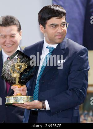 World chess champion Viswanathan Anand of India holds a trophy at an award  presentation ceremony of the FIDE World Chess Championship in Moscow,  Russia, Thursday, May 31, 2012. Anand oretained his title