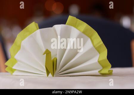 origami peacock napkin table decoration Stock Photo
