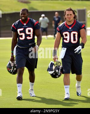 Houston Texans linebackers Jadeveon Clowney, left, and Whitney Mercilus  clean out their lockers at NRG Stadium after being eliminated from the  playoffs, Sunday, Jan. 10, 2016, in Houston. (Brett Coomer/Houston  Chronicle via