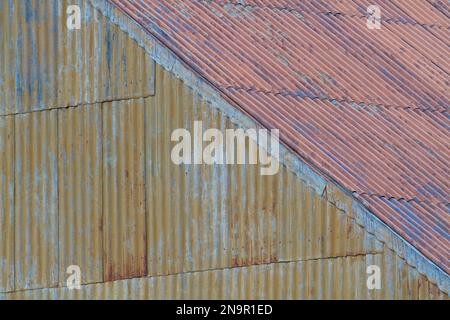 Rusty corrugated metal building at the abandoned Stromness whaling station; South Georgia Island Stock Photo