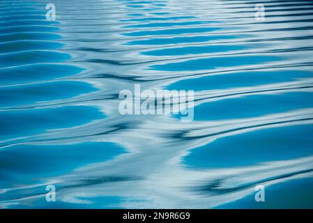 Reflections on ripples of blue water, Endicott Arm - Ford's Terror Wilderness, Inside Passage, Alaska; Alaska, United States of America Stock Photo
