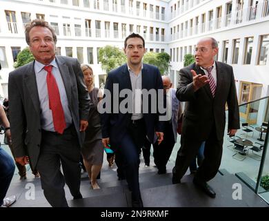 Alexis Tsipras, center, the leader of Greece's anti-austerity Syriza coalition, arrives for a press conference with leaders of Germany's Left Party Klaus Ernst, left, and Gregor Gysi in Berlin, Germany, Tuesday, May 22, 2012. (AP Photo/Ferdinand Ostrop)
