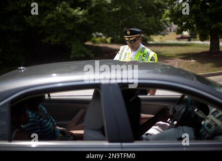 Police officer escorting man in handcuffs Stock Photo - Alamy