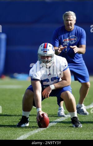 Buffalo Bills' Mark Asper (63) runs a drill with offensive line coach Joe  D'Alessandris during NFL football rookie camp in Orchard Park, N.Y.,  Friday, May 11, 2012. (AP Photo/David Duprey Stock Photo 