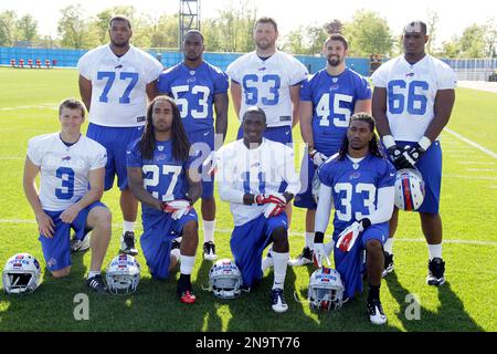 Buffalo Bills' Mark Asper (63) runs a drill with offensive line coach Joe  D'Alessandris during NFL football rookie camp in Orchard Park, N.Y.,  Friday, May 11, 2012. (AP Photo/David Duprey Stock Photo 