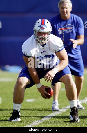 Buffalo Bills' Mark Asper (63) runs a drill with offensive line coach Joe  D'Alessandris during NFL football rookie camp in Orchard Park, N.Y.,  Friday, May 11, 2012. (AP Photo/David Duprey Stock Photo 