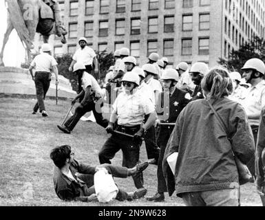 https://l450v.alamy.com/450v/2n9w628/file-in-this-aug-26-1968-file-photo-chicago-police-officers-confront-a-demonstrator-on-the-ground-at-grant-park-in-chicago-during-the-citys-hosting-of-the-democratic-national-convention-chicago-police-officers-will-be-facing-big-challenges-when-protesters-descend-on-the-city-for-the-upcoming-summit-of-nato-leaders-may-20-21-2012-the-force-boasts-of-embracing-modern-techniques-and-groundbreaking-crowd-control-strategies-but-has-never-completely-shaken-its-reputation-for-brutality-and-misconduct-the-coming-protests-also-are-the-big-test-for-police-superintendent-garry-mccarthy-a-forme-2n9w628.jpg