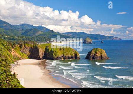Crescent Beach looking South along the Oregon coast to Haystack Rock in Ecola State Park; Oregon, United States of America Stock Photo