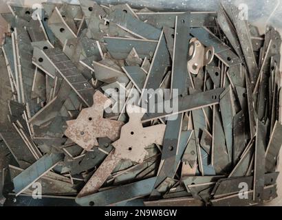 Top of view of the metal rubbish dump. Used steel. Metal background. Stock Photo