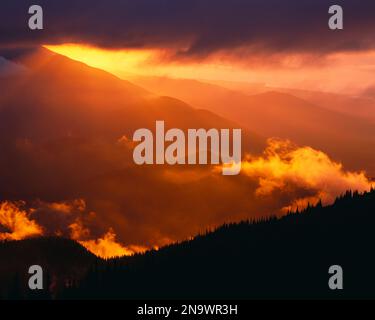 Sun Setting behind Mountain Range, Olympic National Park, Washington State, USA; Washington, United States of America Stock Photo