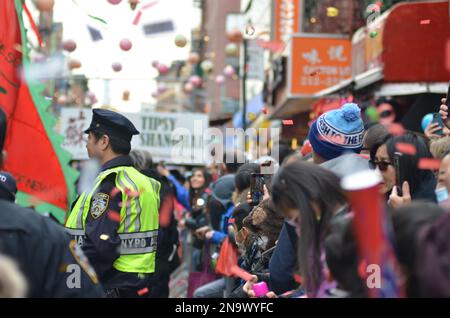 New York City, United States. 12th February, 2023. Confetti flies at the 25th Annual Chinese Lunar New Year Parade and Festival in Manhattan-Chinatown. Credit: Ryan Rahman/Alamy Live News Stock Photo