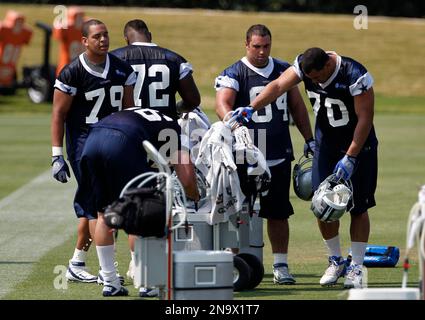 Dallas Cowboys' Ben Bass (79) sacks Arizona Cardinals' Drew Stanton (5) as  Cardinals' Nate Potter, right, tries to block in the first half of a  preseason NFL football game on Saturday, Aug.