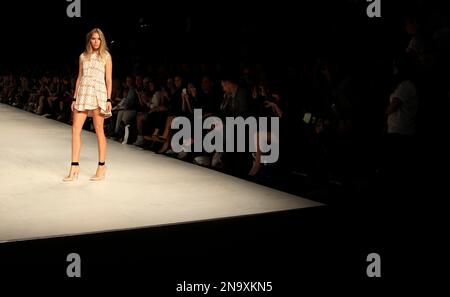 a model wearing an outfit from designer toi et moi sydney poses at the end of the runway during fashion week australia in sydney tuesday may 1 2012ap photorob griffith