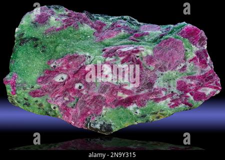 Anyolite is a very colorful rock composed mainly of zoisite. It is also known as "ruby in zoisite" because it is composed of green zoisite with bright Stock Photo