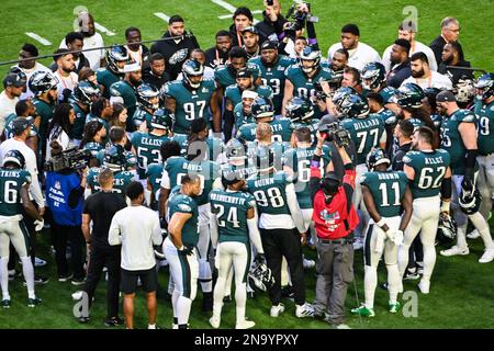 Philadelphia Eagles offensive players huddle up in a group as quarterback  Jalen Hurts (1) calls a play in the huddle during an NFL football game  against the Dallas Cowboys, Monday, Sept. 27