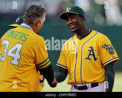 Hall of Famer Rollie Fingers pitches during the Hall of Fame Classic  baseball game in Cooperstown, N.Y., Sunday, June 20, 2010. (AP Photo/Kevin  Rivoli Stock Photo - Alamy