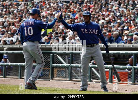 Texas Rangers' Josh Hamilton, left, reaches back to hit Elvis Andrus,  right, on the head with a rosin bag as the two joke around during a  baseball team practice for the World