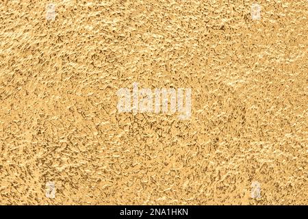 Gold texture or background. Embossed golden metal pattern. Abstract shiny yellow. Stock Photo