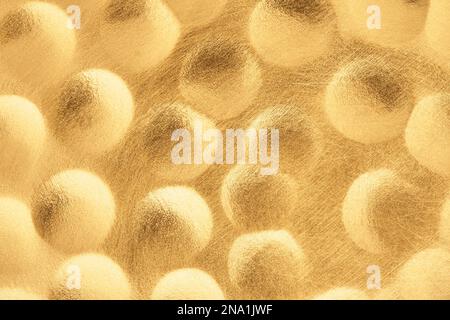 Abstract golden background. Gold scratched texture with volumetric bubbles pattern. Futuristic style. Stock Photo